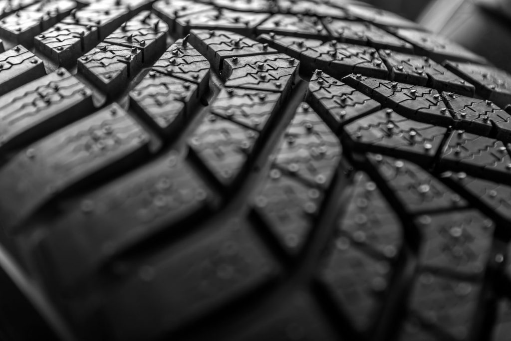 Close-up of car tire tread depth