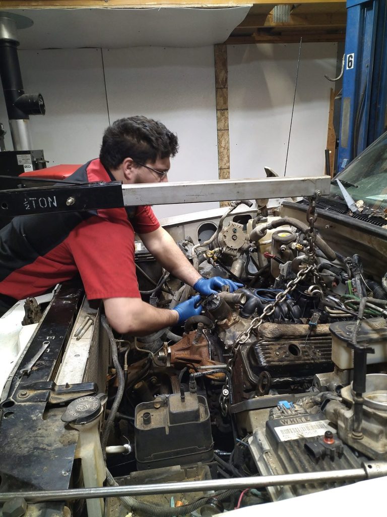 Engine repair in progress at TinJToo Auto Repair