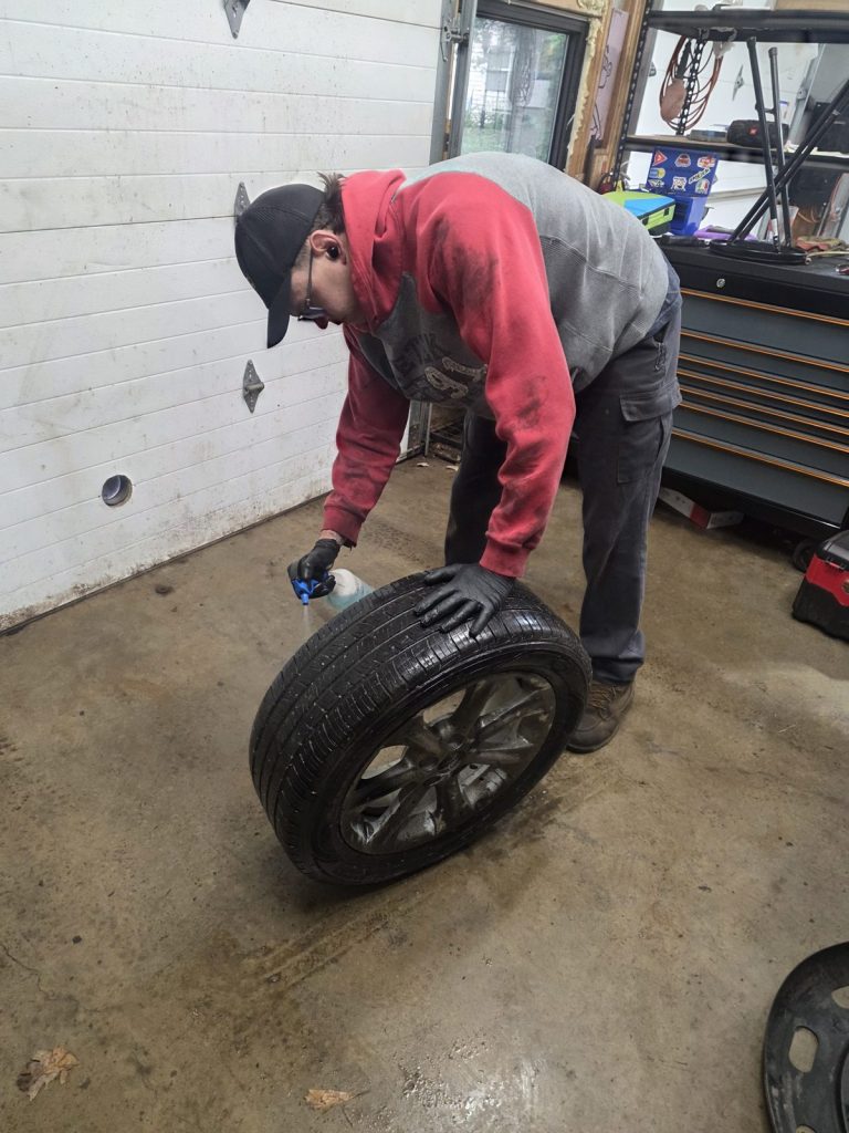 Tire service on the shop floor at TinJToo Auto Repair